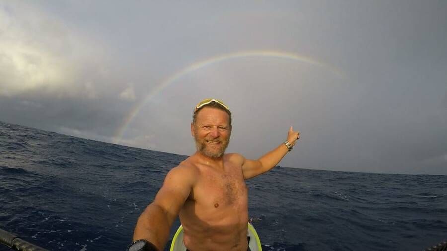 Antonio de la Rosa Points To Rainbow At Sea
